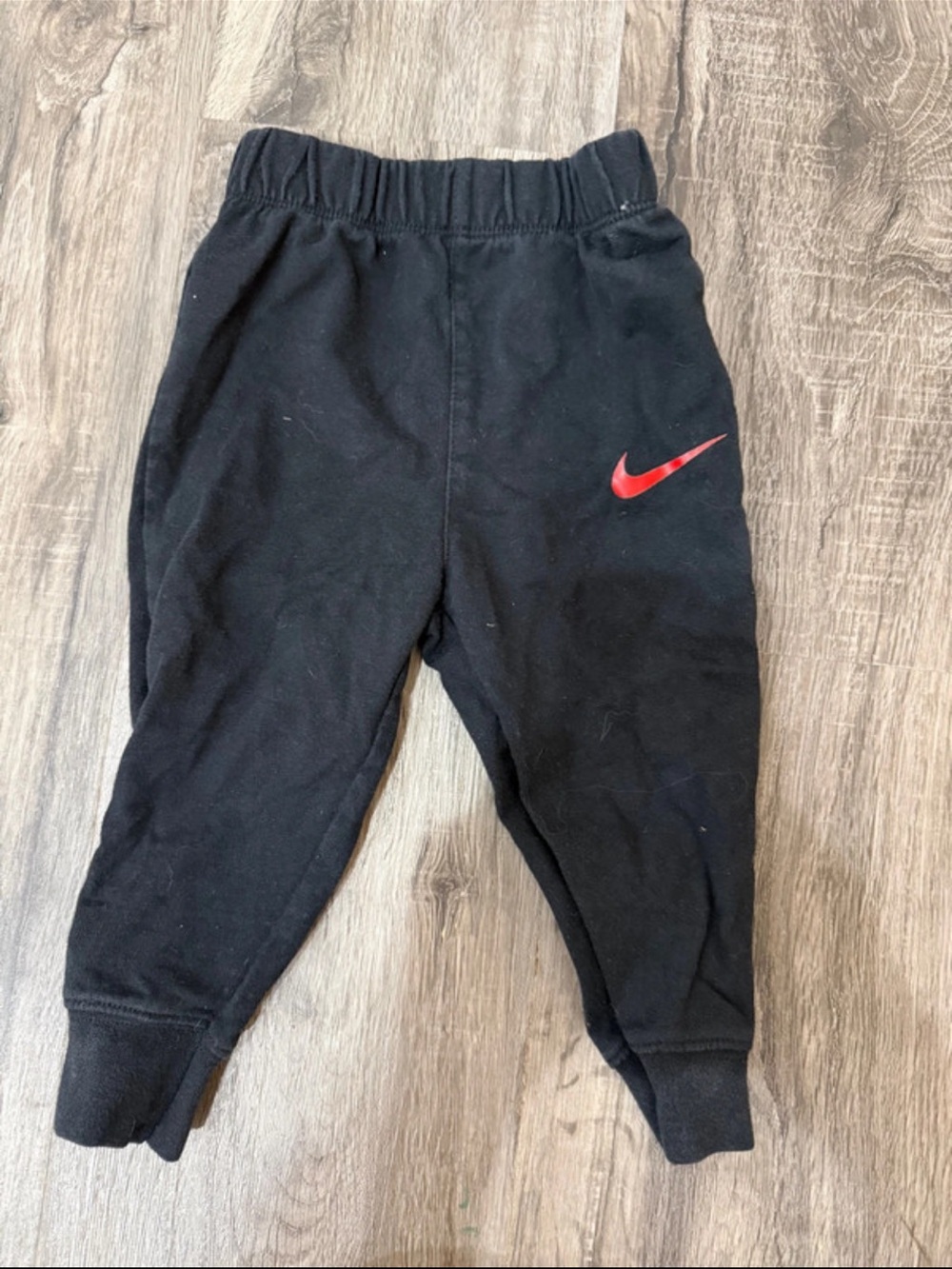 Nike Kids Black Sweatpants with Red Swoosh